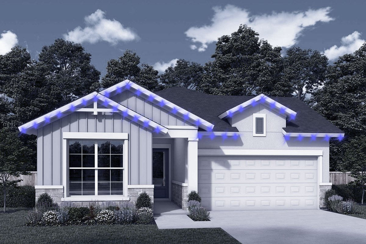 One-story home with garage—roofline lights positioned along gables and eaves.